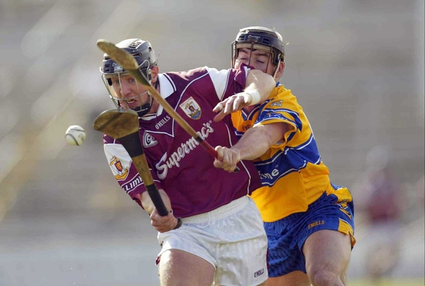 Clare's David Forde tackles Galway's Damien Joyce during today's Divison IA clash.
