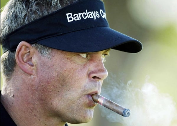Darren Clarke's mistake on the 18th costs him a share of the lead