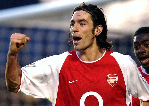 Robert Pires' penalty saw Arsenal top their group