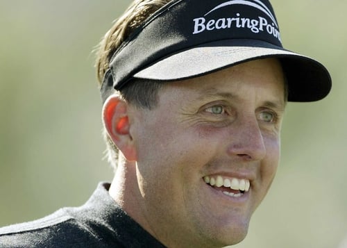 Defending champion Phil Mickelson is four shots off the lead in Scottsdale