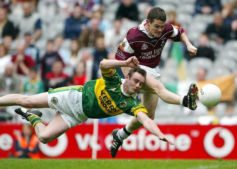 Galway's Declan Meehan shoots for goal despite the close attentions of Kerry's William Kirby.