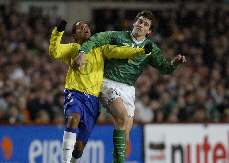 Kevin Kilbane tussles with Brazil's Ronaldhino during the recent International friendly at Lansdowne Road.