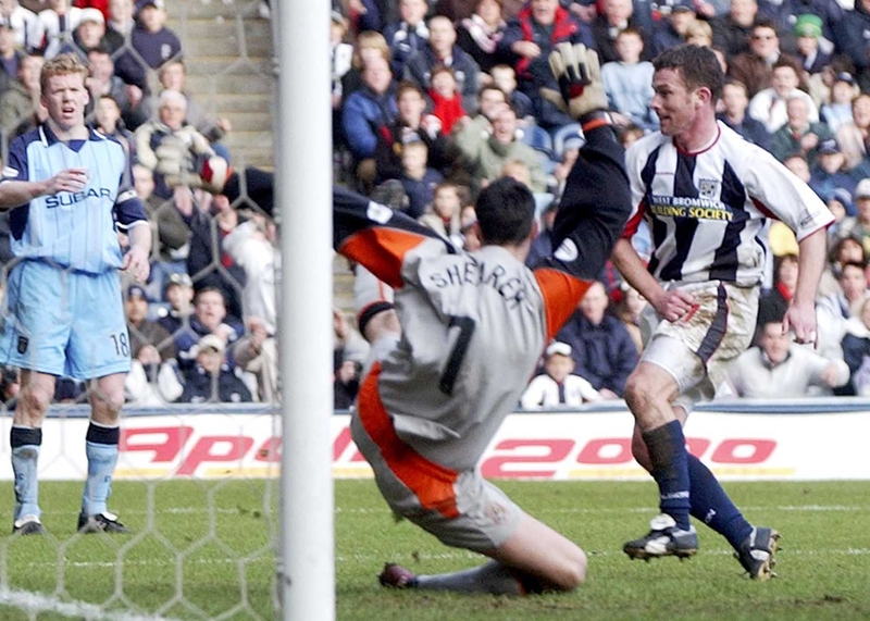 Mark Kinsella scores against Coventry while Steve Staunton looks on.