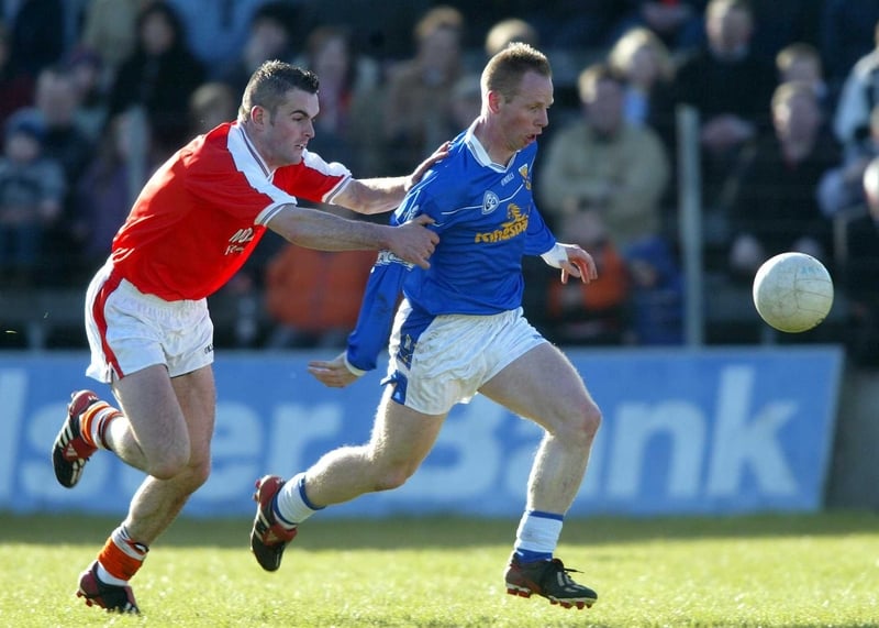 Anthony Forde of Cavan is tracked by Paul Watters of Armagh