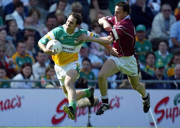 Roy Malone of Offaly escapes Westmeath's Damien Healy