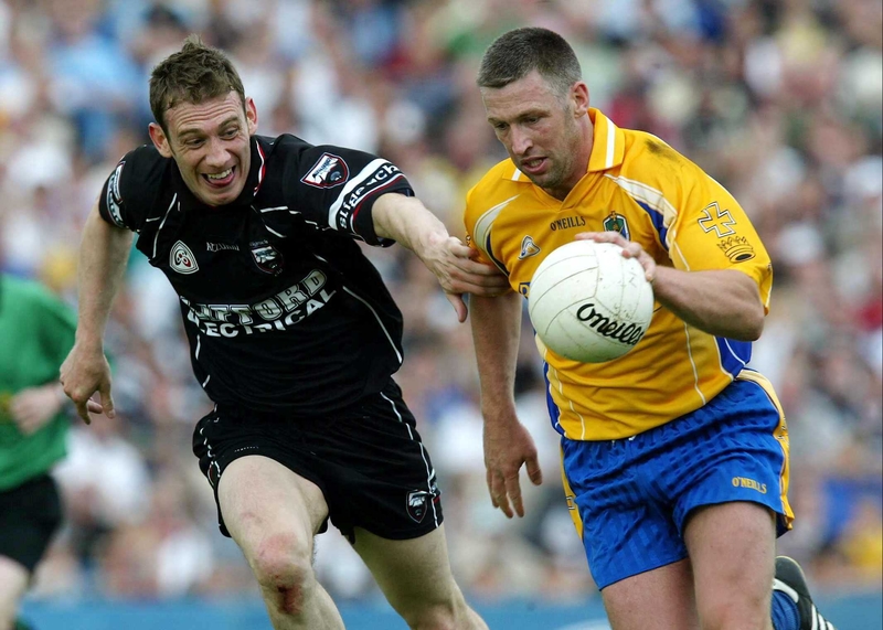 Sligo's Noel McGuire attempts to stop the run of Roscommon's Nigel Dineen