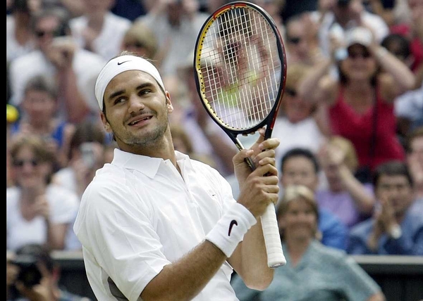 Top seed Roger Federer moved into the third round of the French Open