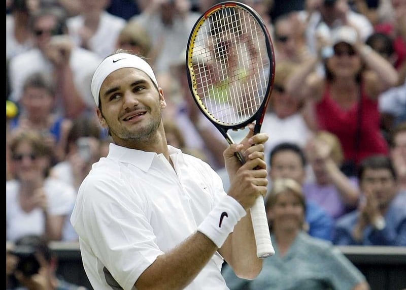 Top seed Roger Federer moved into the third round of the French Open