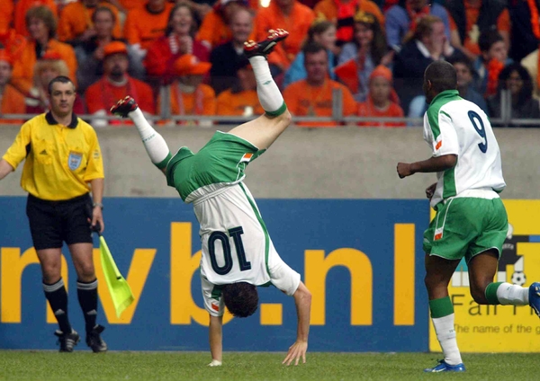 Robbie Keane celebrates after scoring against Holland