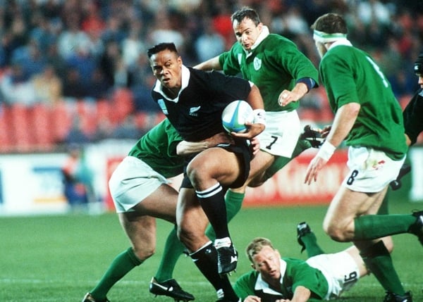 Jonah Lomu - pictured here against Ireland - wants to wear that famous black jersey again