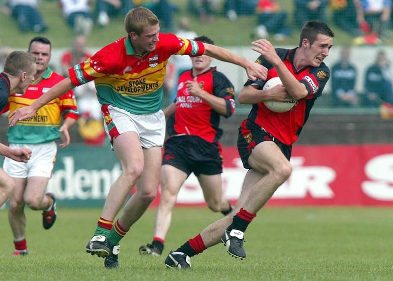 Down's Dan Gordon fends off a challenge from Carlow's Willie Power