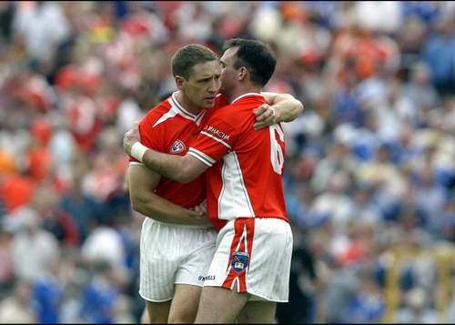 Armagh's Kieran McGeeney and Aidan O'Rourke congratulate each other