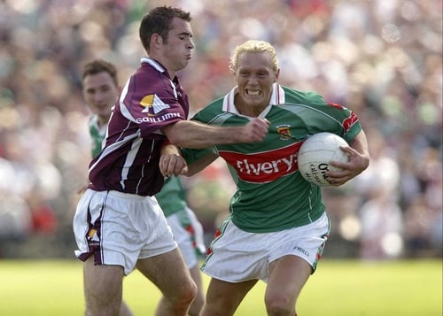Mayo's Kieran McDonald fends off Galway's Damien Burke