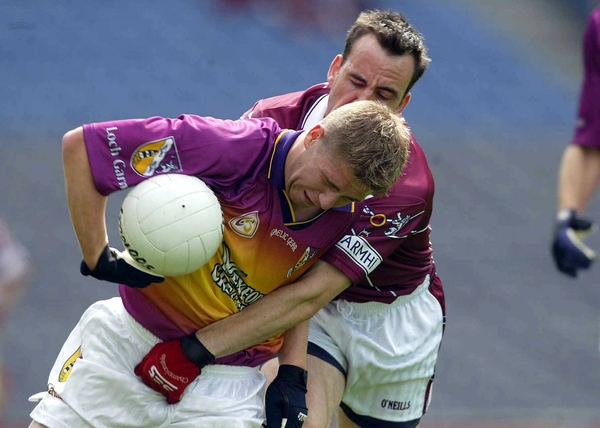Wexford's Darren Foran is challenged by Westmeath's Damien Healy