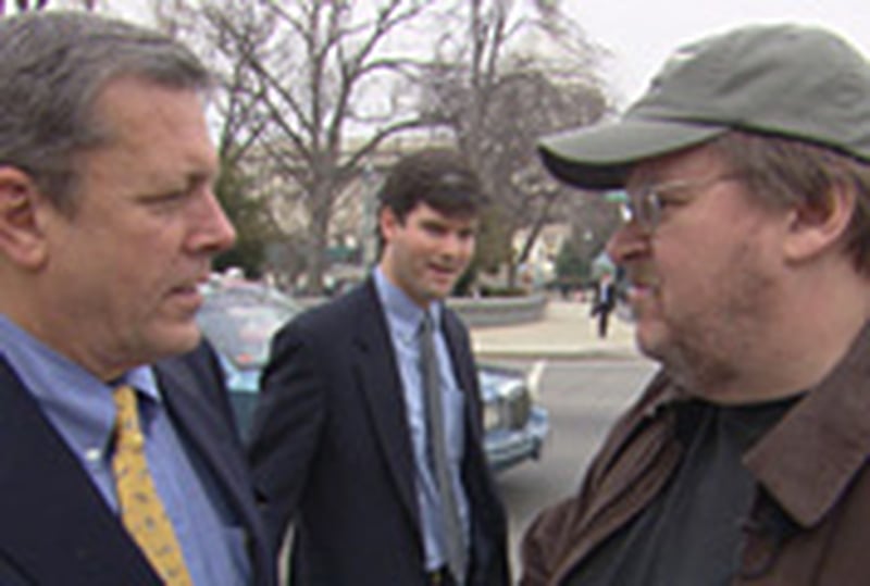 Michael Moore confronts in Fahrenhei t 9/11