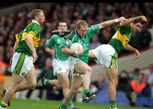 Limerick's Stephen Kelly holds off the Kerry challenges
