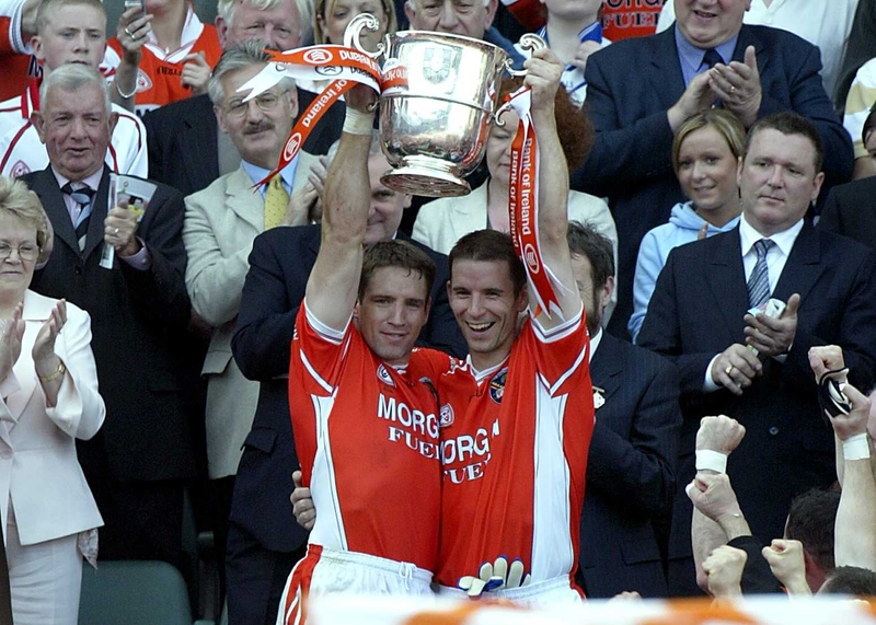 Kieran McGeeney and Paul McGrane lift the Anglo Celt Cup following their comprehensive win over Donegal