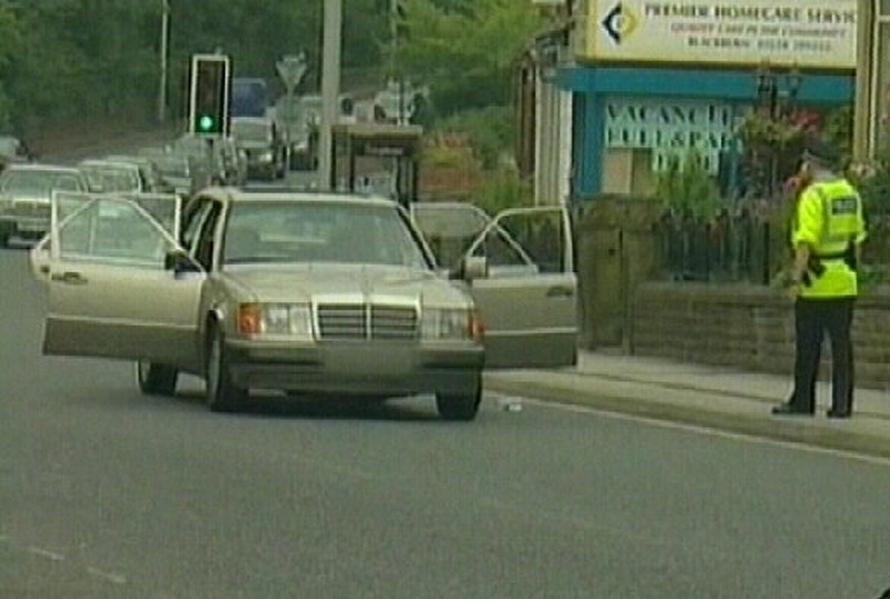 Britain - 12 still quizzed after raids