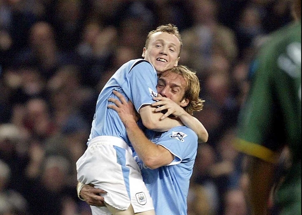 Willo Fllod (left) celebrates during happier days at Manchester City