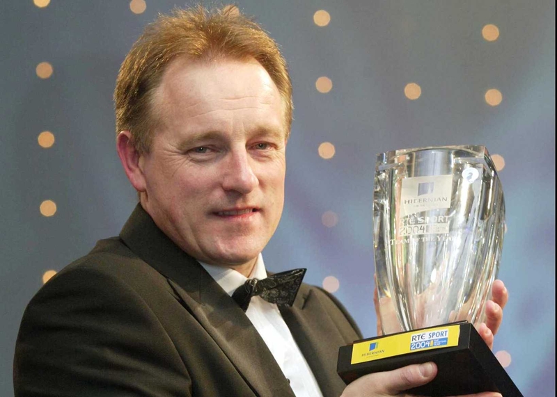 Ireland rugby coach Eddie O'Sullivan proudly shows off his side's Team of the Year award