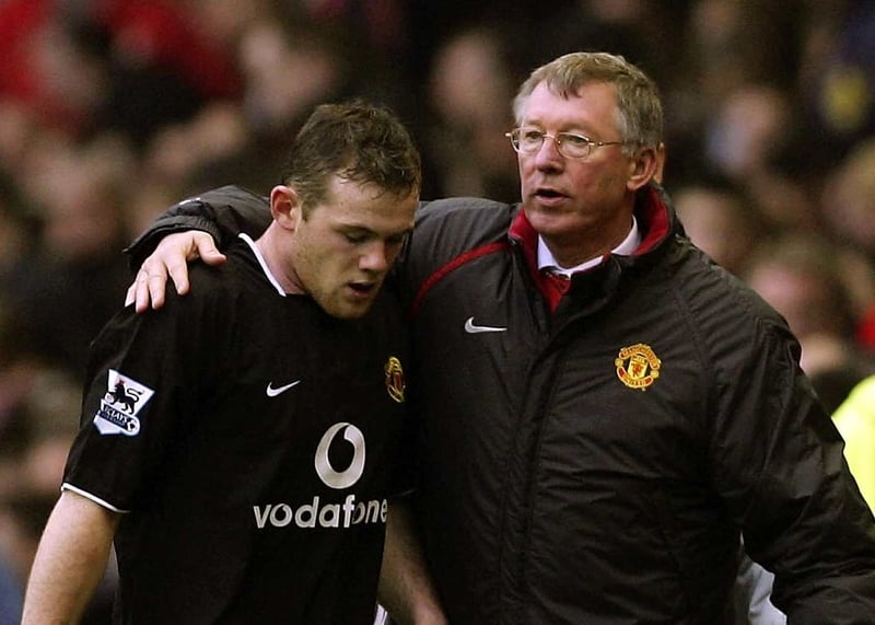 Wayne Rooney receives a comforting arm from United manager Alex Ferguson