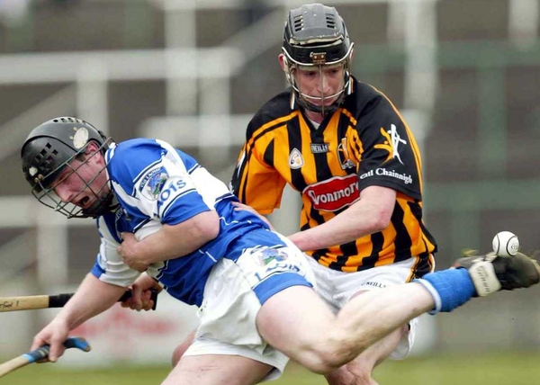 Martin Comerford of Kilkenny and Seamus Dwyer of Laois in action this afternoon