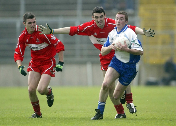 Tomás Freeman, Monaghan's goalscorer, eludes Derry's Gavin Donaghy and Kevin McGuckin