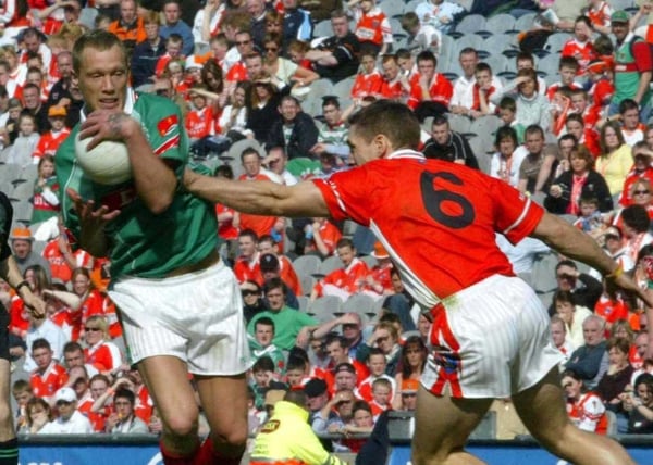 Ciaran McDonald of Meath is challenged by Armagh's Kieran McGeeney
