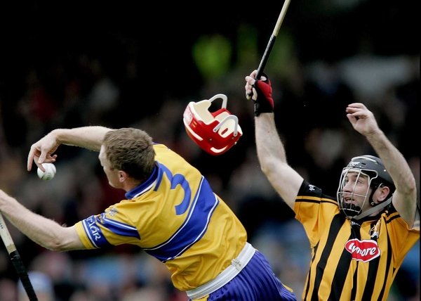 Clare's Brian Lohan and DJ Carey of Kilkenny tussle in today's National Hurling League final