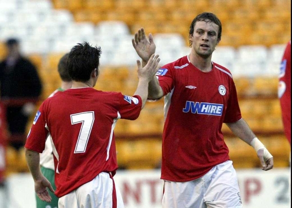 Jamie Harris celebrates the controversial goal with team-mate Wes Hoolahan