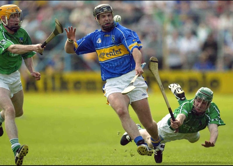 Tipp's Colin Morrissey is tackled by Paul O'Grady and Andrew O'Shaughnessy of Limerick