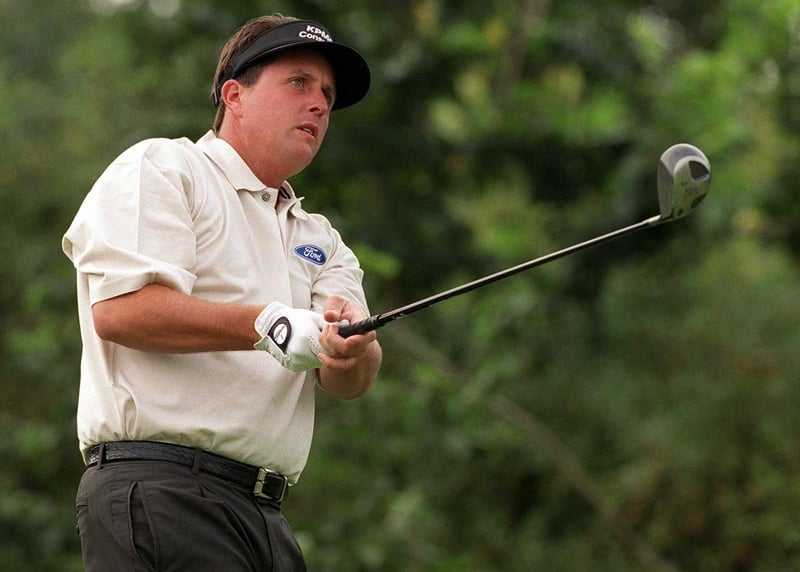 Phil Mickelson birdied two of the last three holes he played on Friday to join defending champion Tiger Woods, Scott Verplank and Colombia's Camilo Villegas in a tie for the second-round lead at the Ford Championship