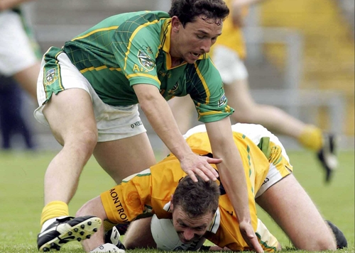Antrim's Mark McCrory struggles to fend off Meath's David Crimmins