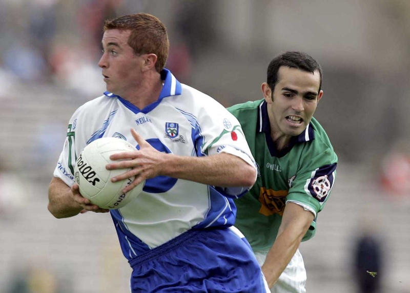 Monaghan's Thomas Freeman pulls away from James Rafter of London