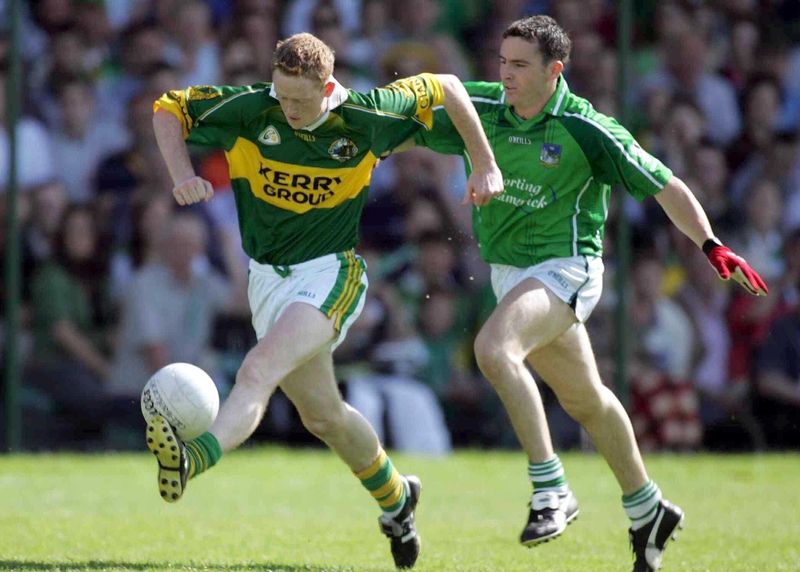 Colm Cooper skips away from Limerick's Mark O'Riordan, who controversially got his marching orders after an incident with 'Gooch' in the 55th minute