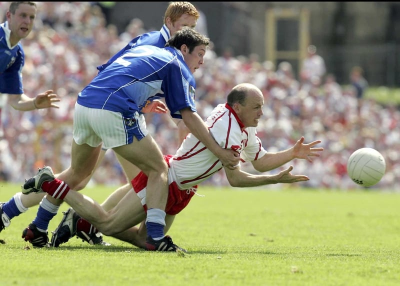 Peter Canavan under pressure from Cavan's Michael Hannon during last week's drawn game