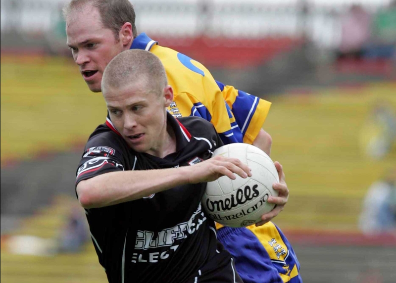 Sligo's Jonathon Davey goes past Michael O'Shea of Clare
