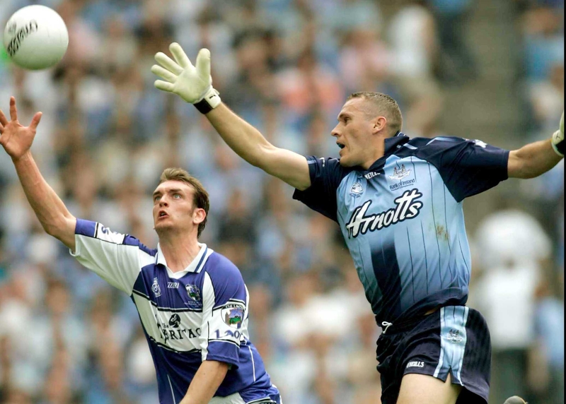 Laois' Noel Garvan and Dublin's Ciaran Whelan stretch for the ball during today's thrilling Leinster SFC final