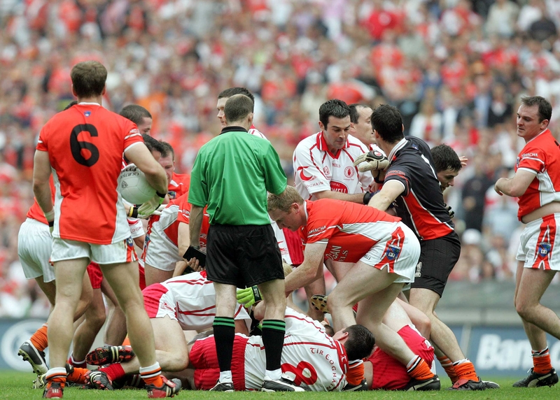 Armagh and Tyrone players tussle on the ground prior to dismissal of Tyrone's Peter Canavan and Armagh's Ciaran McKeever