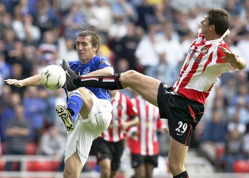 Alan Stubbs, then with Everton, clashes with Niall Quinn of Sunderland in 2002