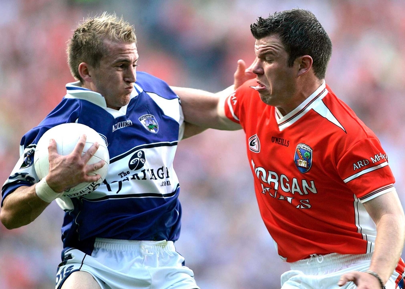 Armagh's Ronan Clarke challenges Joe Higgins of Laois during the Orchard men's facile win at Croke Park today