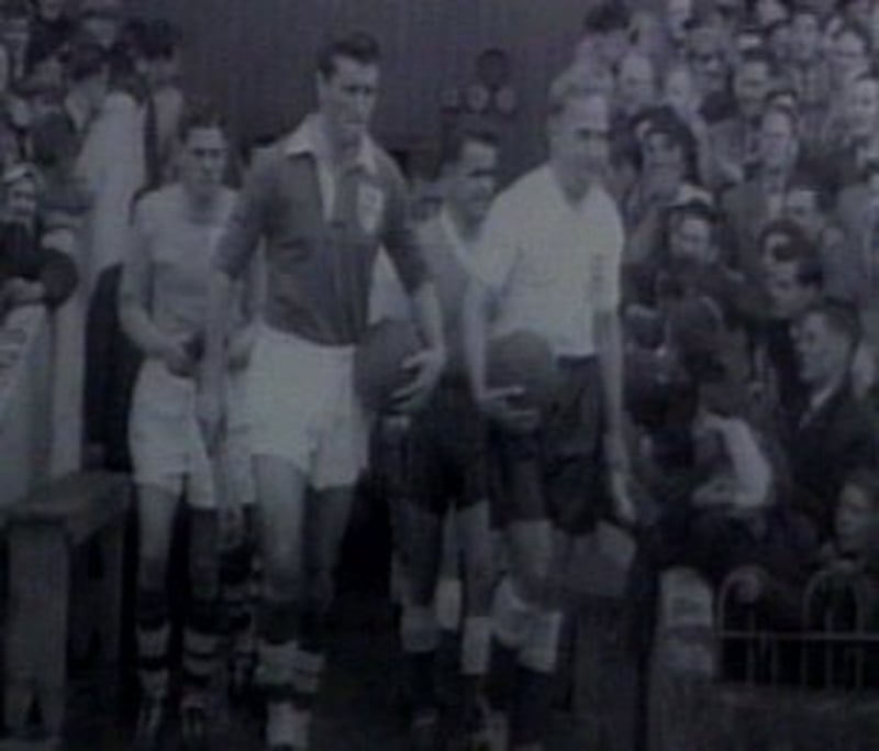 Noel Cantwell leads Ireland out against England at Dalymount Park in 1957