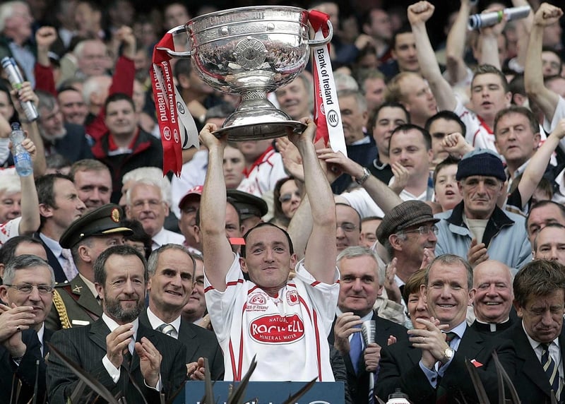 Tyrone captain raises the Sam Maguire Cup aloft