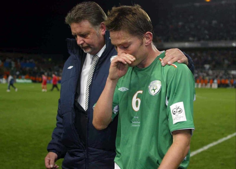 A dejected Matt Holland leaves the pitch after last night's disastrous draw with Switzerland