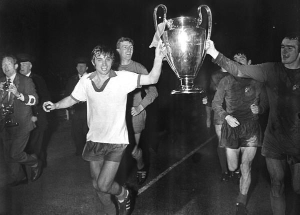George Best in his glory days, pictured here lifting the European Cup with Manchester United
