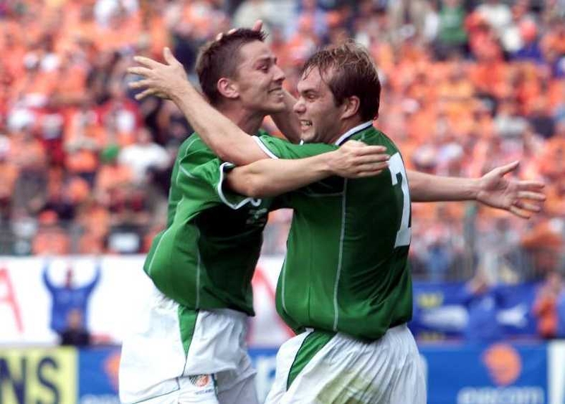 Jason McAteer and Matt Holland celebrate McAteer's goal, which saw Ireland qualify for the 2002 World Cup