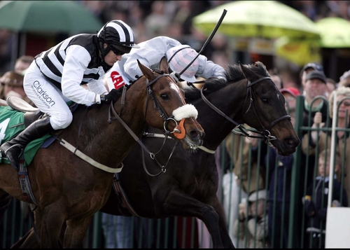 Rathgar Beau (far side) and Moscow Flyer are locked in battle during the 2005 Kerrygold Champion Chase at Punchestown