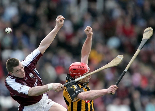 Eugene Cloonan and John Tennyson battle for the ball