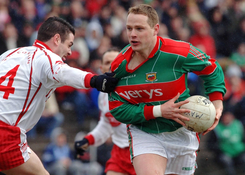 Mayo's Ger Brady is tackled by Michael McGee of Tyrone