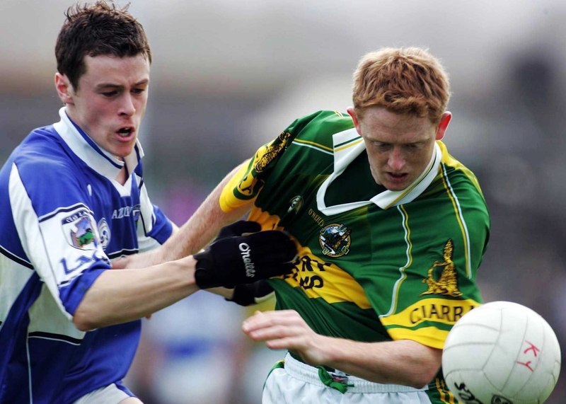 Padriag McMahon of Laois gets to grips with Kerry's Colin Cooper